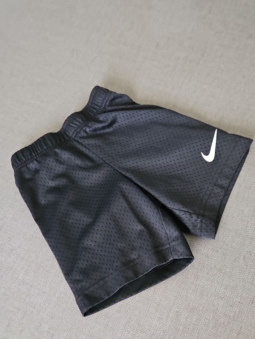 Nike Black Mesh Shorts with White Swoosh Logo